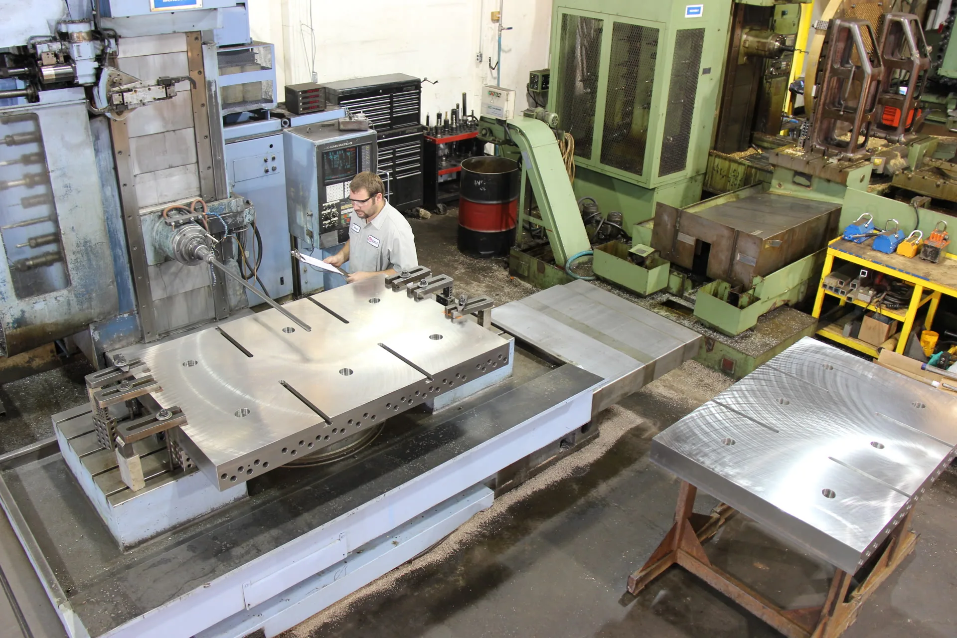 KTM shop floor — large machined platens on the horizontal boring mill